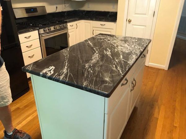 Buffing granite countertop black in the kitchen