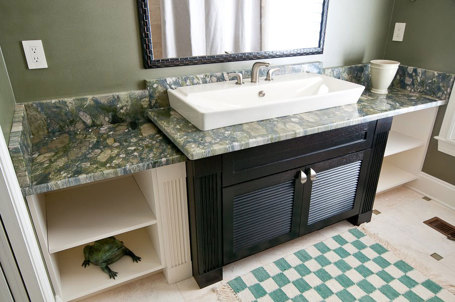 Avant-Garde countertop in the bathroom made of green granite