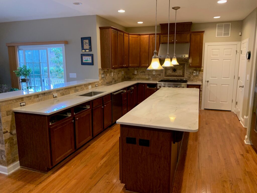 Open concept kitchen island with stove with natural stone Quartzite