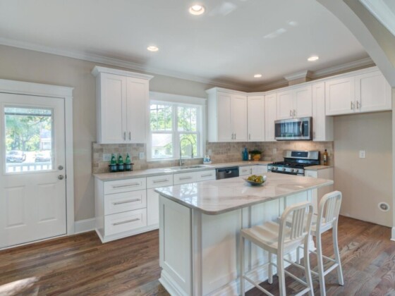 Coastal white kitchen with marble island
