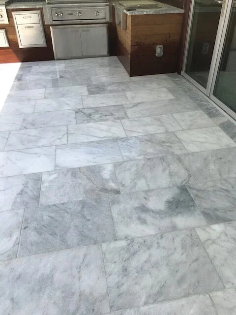 Patio with large white marble floor tiles
