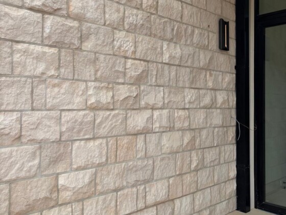 Natural limestone thin veneer installed on a modern exterior wall