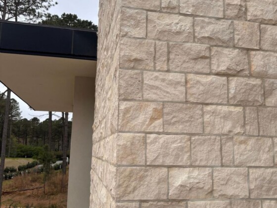 Close-up of natural limestone thin veneer on a modern home exterior corner