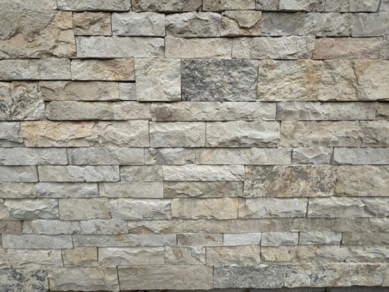 Close-up of Rustic Crema Thin Veneer Limestone wall installation