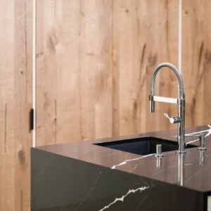 Modern kitchen island with chrome faucet
