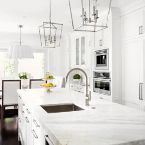 White Carrara marble island with pendant lights