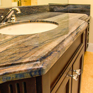 Elegant bathroom countertop with a polished stone surface and built-in sink.