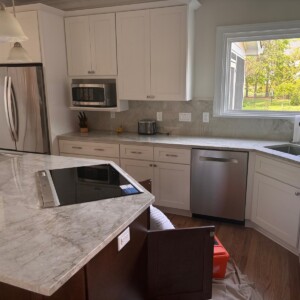 Bright kitchen with stainless appliances and island