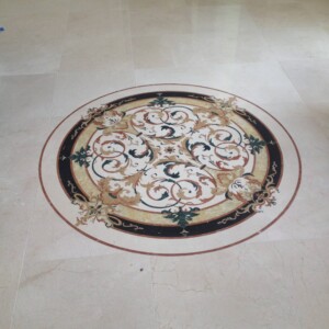 Intricately designed circular floor medallion with ornate floral patterns.