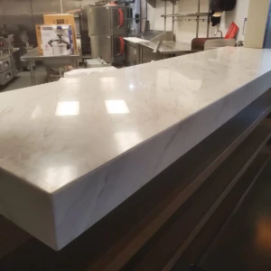 Polished marble countertop in commercial kitchen