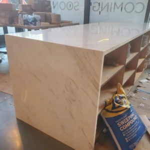 Marble island countertop with open shelves