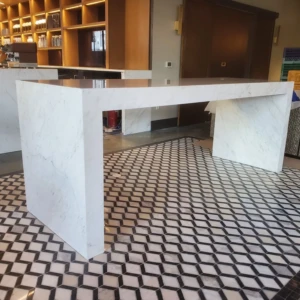 Marble reception counter with geometric tiled floor