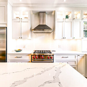 Modern kitchen installed in Westmount, Montreal, Canada Modern white kitchen with marble countertop and stainless steel appliances.