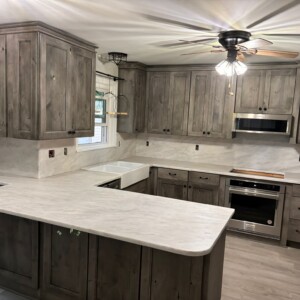 Gray kitchen with island, farmhouse sink